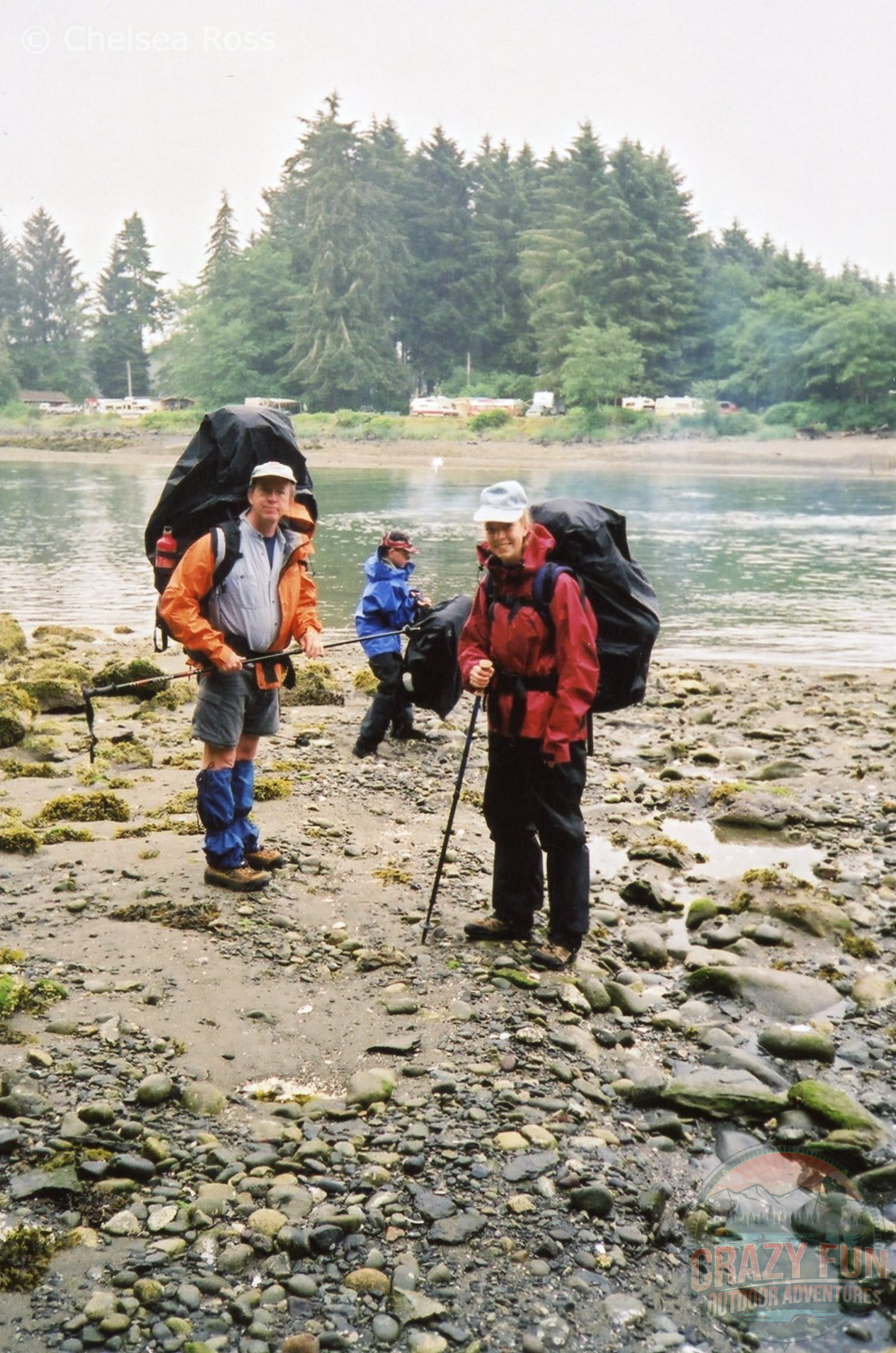 A man, boy and girl on rocks ready to backpack the WCT