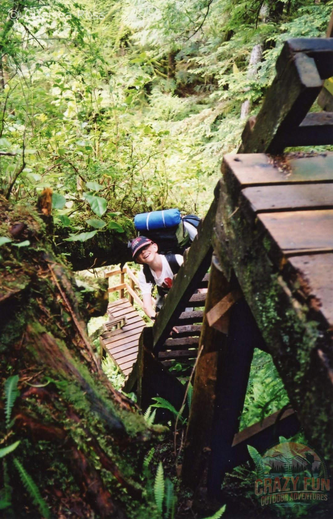 boy going up a ladder backpacking the West Coast Trail