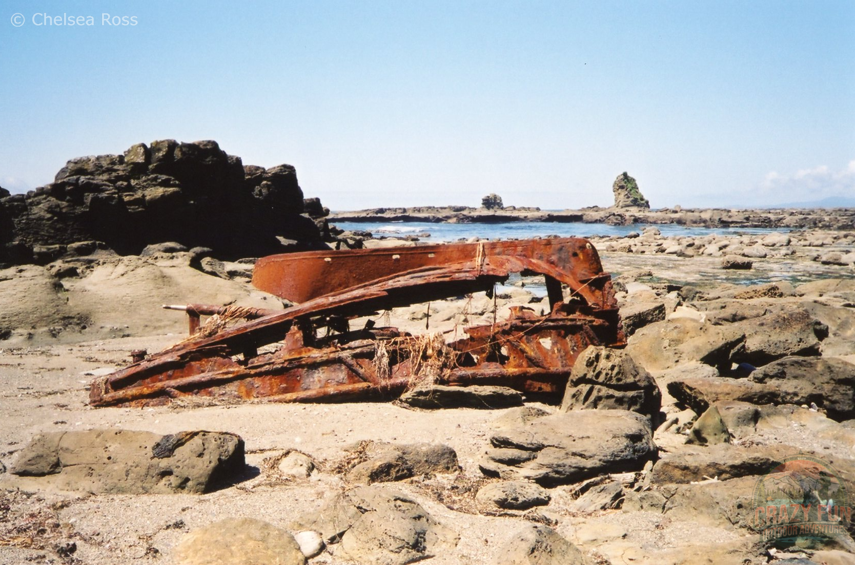 Part of old rusted boat on beach