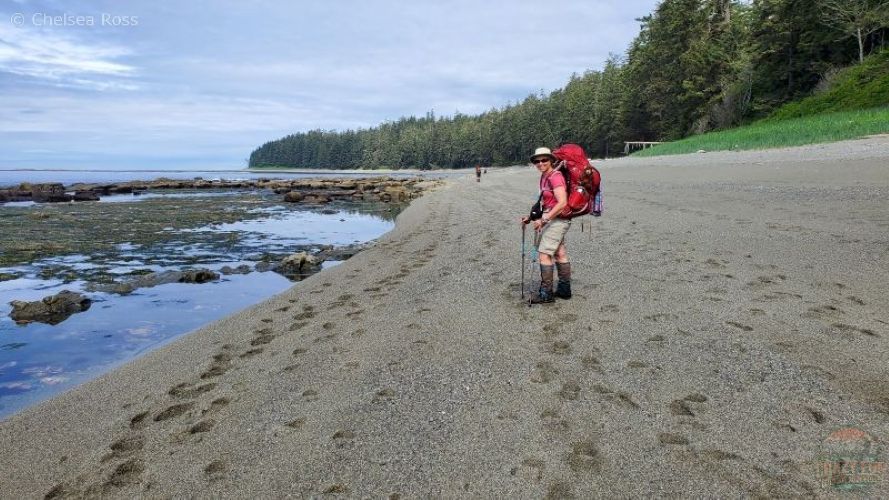 Lady backpacking on the sand
