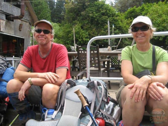 West Coast Trail tips: You'll need to make two ferry crossings. A man with red shirt (left) and woman with green shirt (right) riding on a ferry