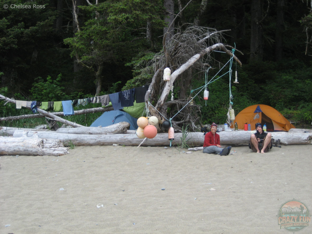 Mom and Scott chilling in front of our set up campsite on the beach