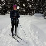 Lady wearing Chaos Multi Tubular Headwear while cross-country skiing.