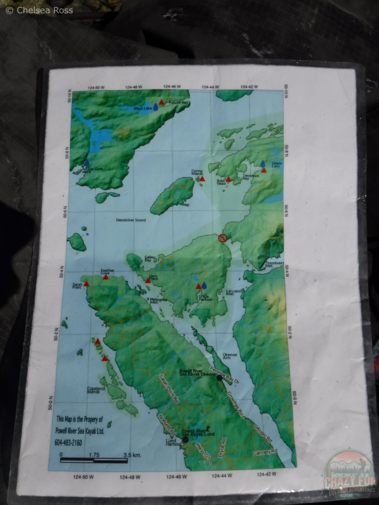 A waterproof map of Kayaking in Desolation Sound. The blue and red triangles indicate where you can camp.