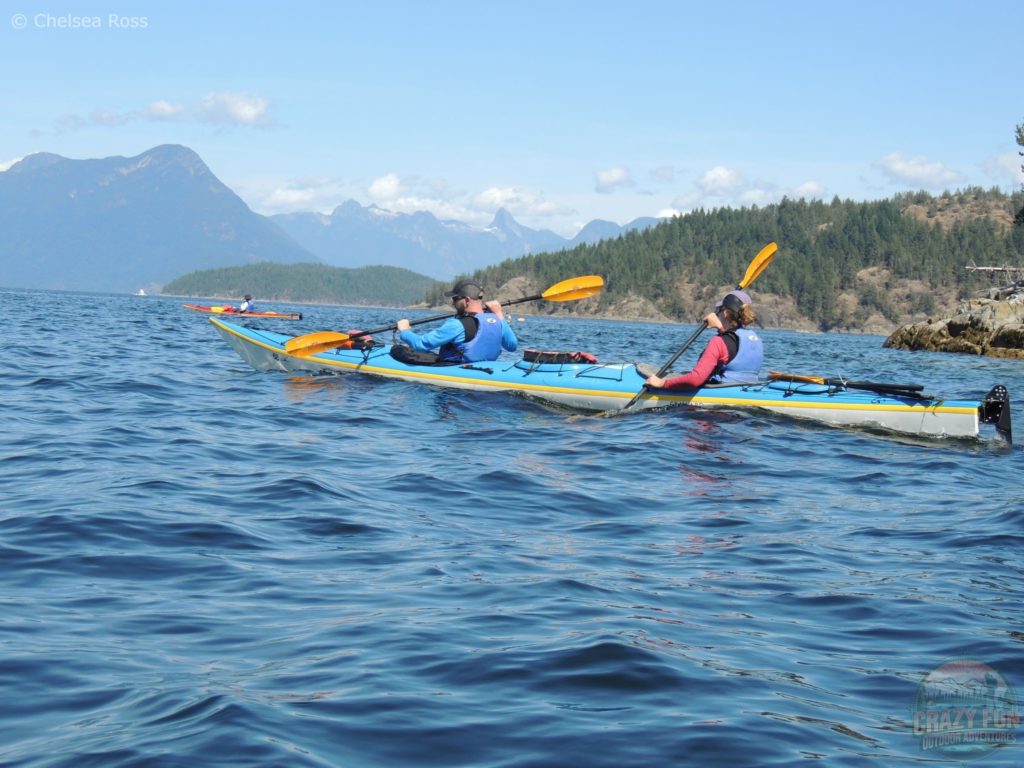 Kris and I on the ocean with rocky hills behind us kayaking in Desolation Sound.