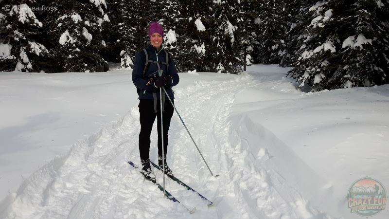 Lady wearing Chaos Multi Tubular Headwear while cross-country skiing. 