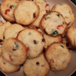 Chocolate Chip Cherry Cookies made from red and green cherries, chocolate chips sit in a plate. They are first on the Top 8 Christmas Desserts to make.