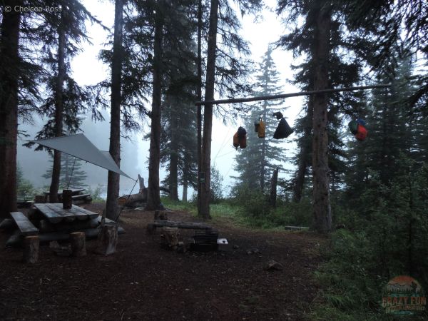 A tarp is protecting the eating area for supper.