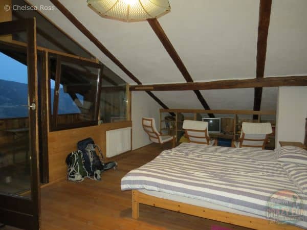 Room showing our bed with chairs to the right. To the left is our private balcony overlooking the valley on our unforgettable hiking holiday in Bolzano.
