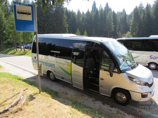 A grey and black bus to head north to Flaas-Valas.
