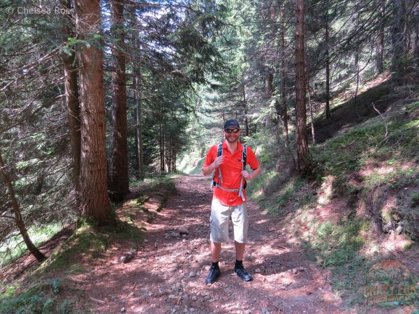 Man standing in the middle of the trail on our unforgettable hiking holiday in Bolzano.
