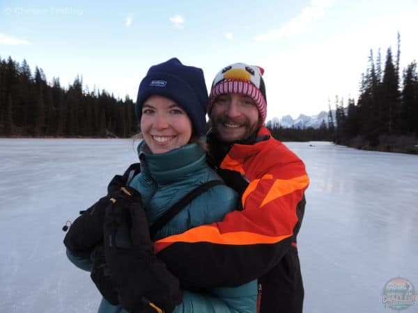 A couple skating in Banff National Park. 