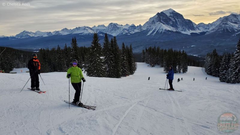 Adults heading down the front side of the mountain.