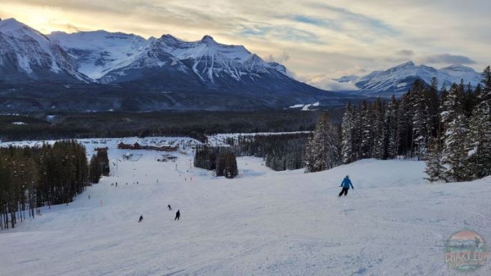 Downhill ski Sunshine or Lake Louise? Lady heading down to the bottom of the Lake Louise ski hill at the end of an awesome day! 