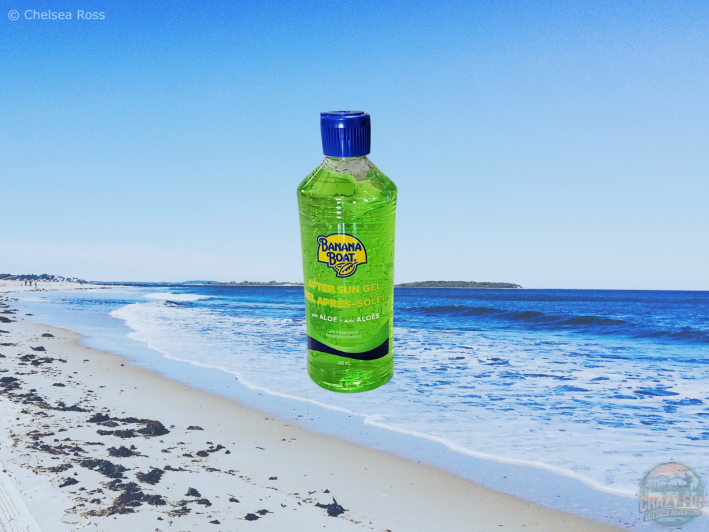 After sun gel with aloe vera to apply to your skin to heal the sunburn. A beach and ocean are in the background.