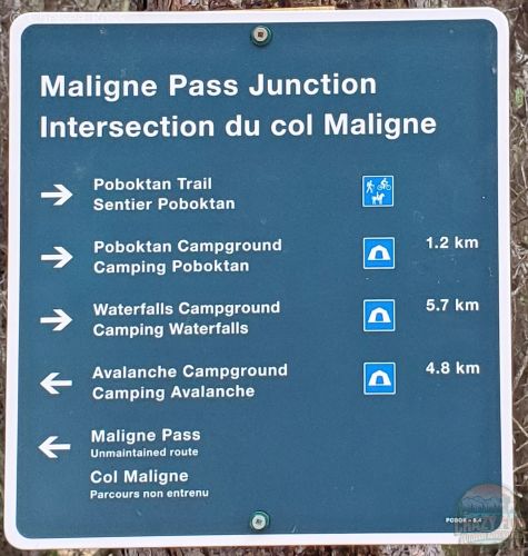 Backpacking Poboktan trail successfully with a map showing us how many kilometres we have left to go. 