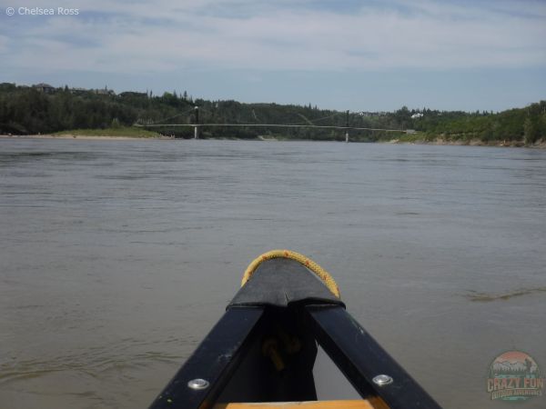 Fort Edmonton footbridge can be seen up ahead on our Devon to Edmonton Canoe trip.