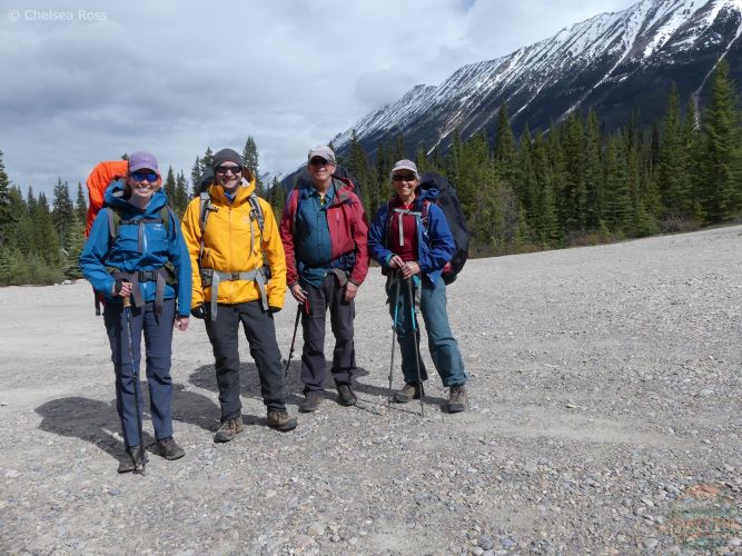Group selfie before backpacking Poboktan trail successfully with our raincoats, pack covers, poles and gaiters in our backpacks. 