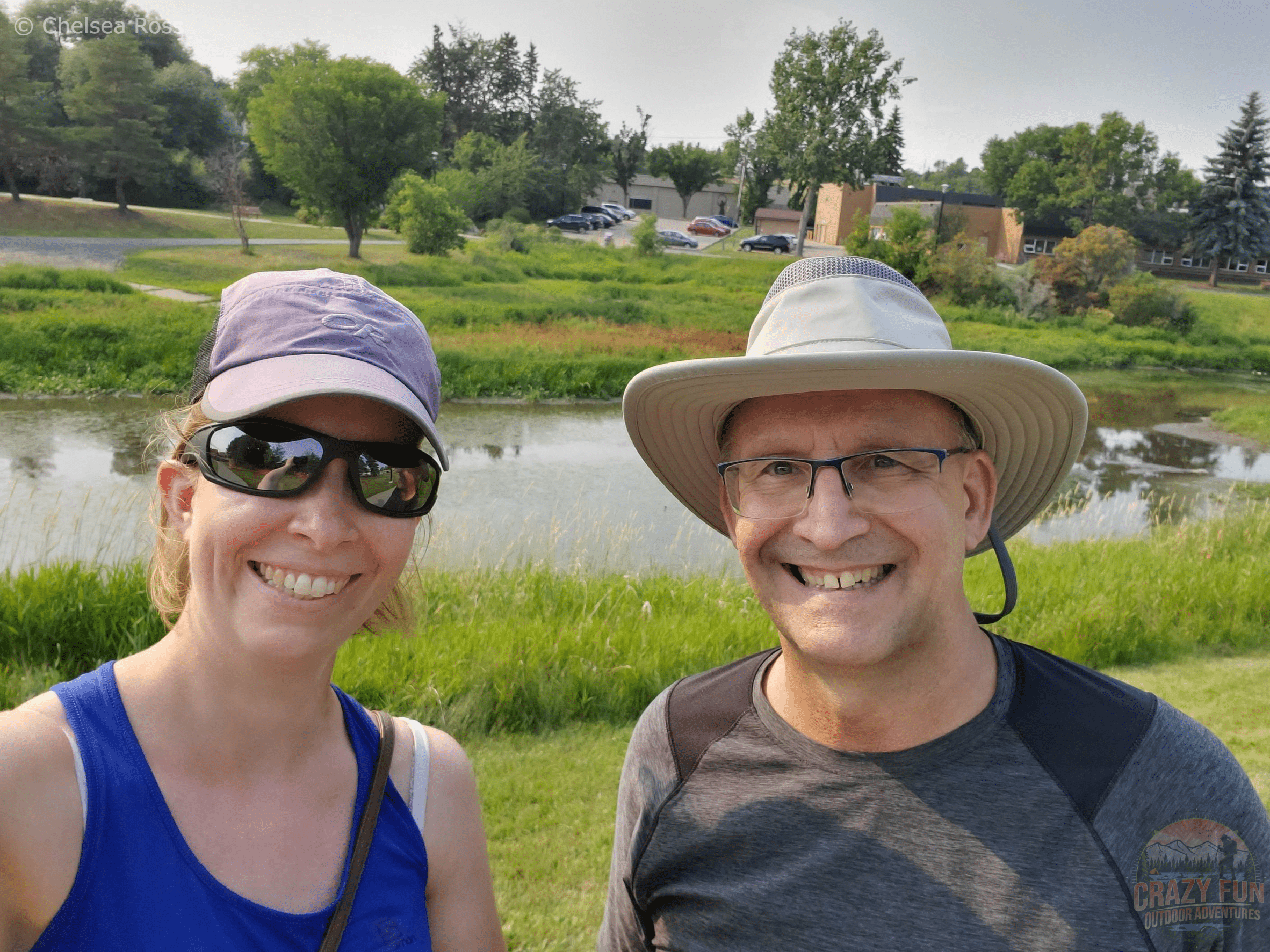 I'm in a blue tank top with a purple hat and Fred is in a grey top with tan hat with St. Albert River behind us.