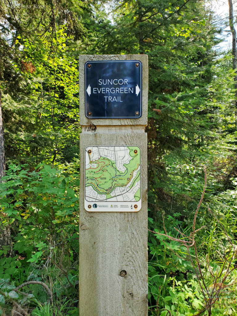 A map and sign of Birchwood hiking trails in Fort McMurray.