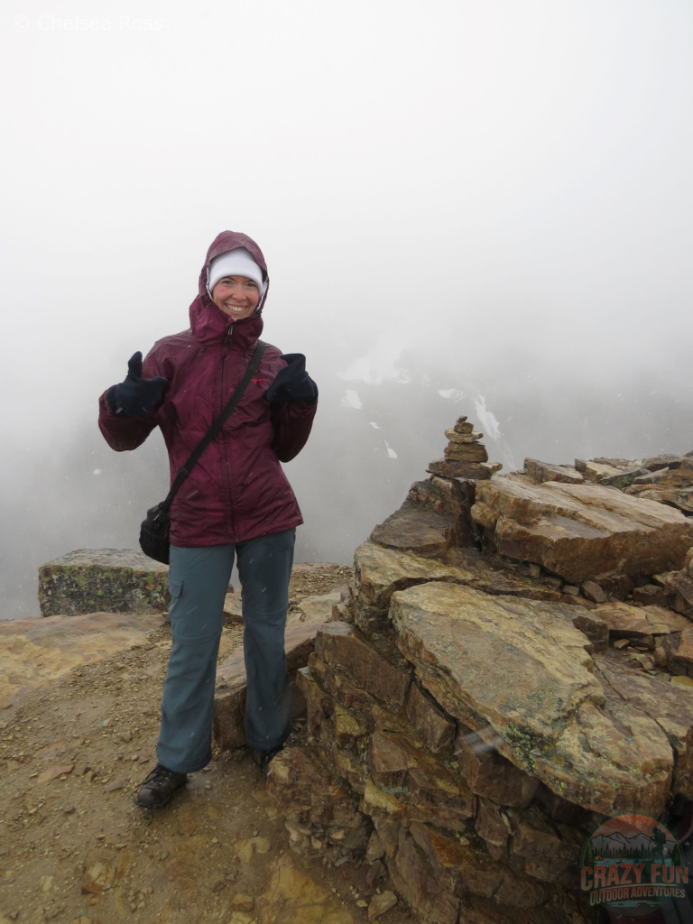 I have my purple jacket and white toque on at the Fairview Lookout summit as it's starting to snow.
