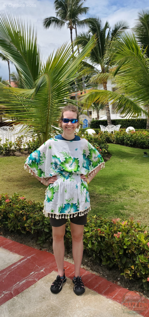 Wearing a light cotton poncho with a large neck and arm opening to keep the hot air circulating around me but also helping to treat a sunburn. 