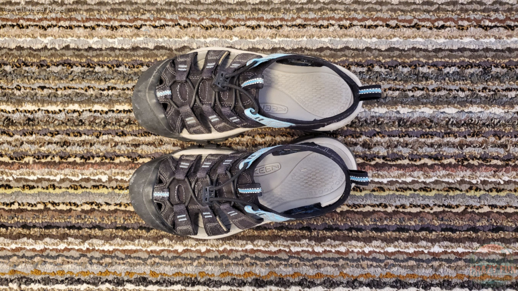 Camera pointed down towards Keen Newport Sandals on the carpet.