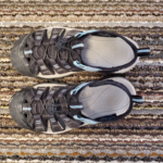 Camera pointed down towards Keen Newport Sandals on the carpet.