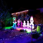 Edmonton Events at Christmas include Candy Cane Lane. The Grinch and snowman are in front of a house.