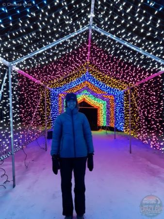 Edmonton Events at Christmas include Zoominescence. I'm standing under different coloured lights in a tunnel.