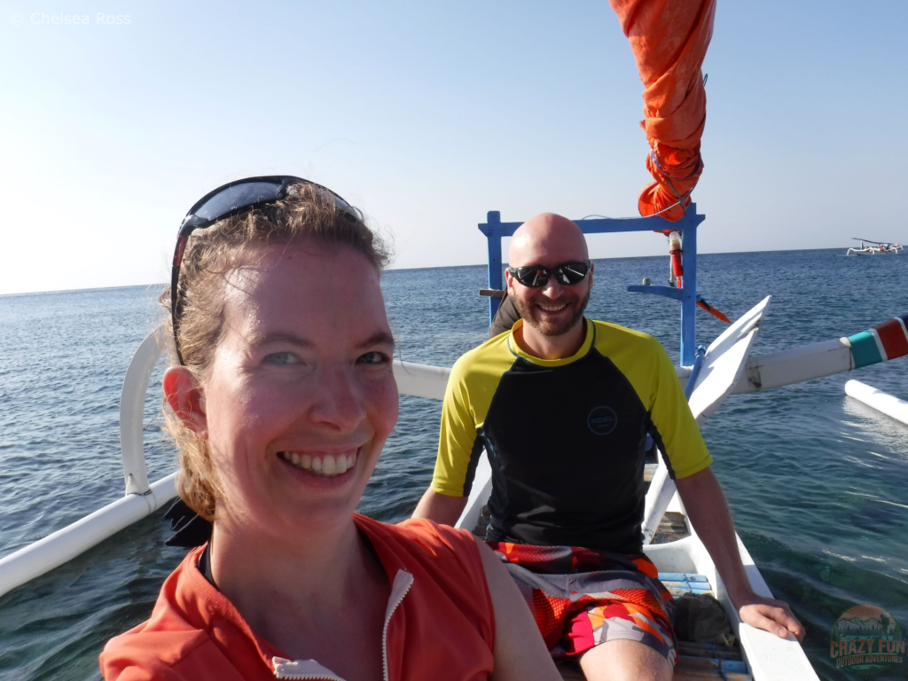 A selfie of Kris and I on the boat on our way to snorkel and see the sunset in Bali. The boat is essential snorkeling gear for beginners to bring us to an excellent location.