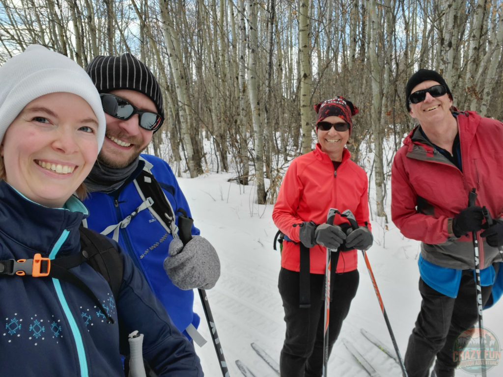 Family quality time at Christmas is us cross-country skiing! Kris and I are in blue to the left of the picture and my parents are in red to the far right, spacing due to Covid. 