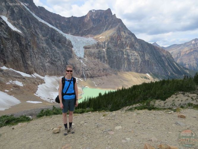 Lady standing up high in front of the Edith Cavell glacier on one of the Best Jasper hikes.