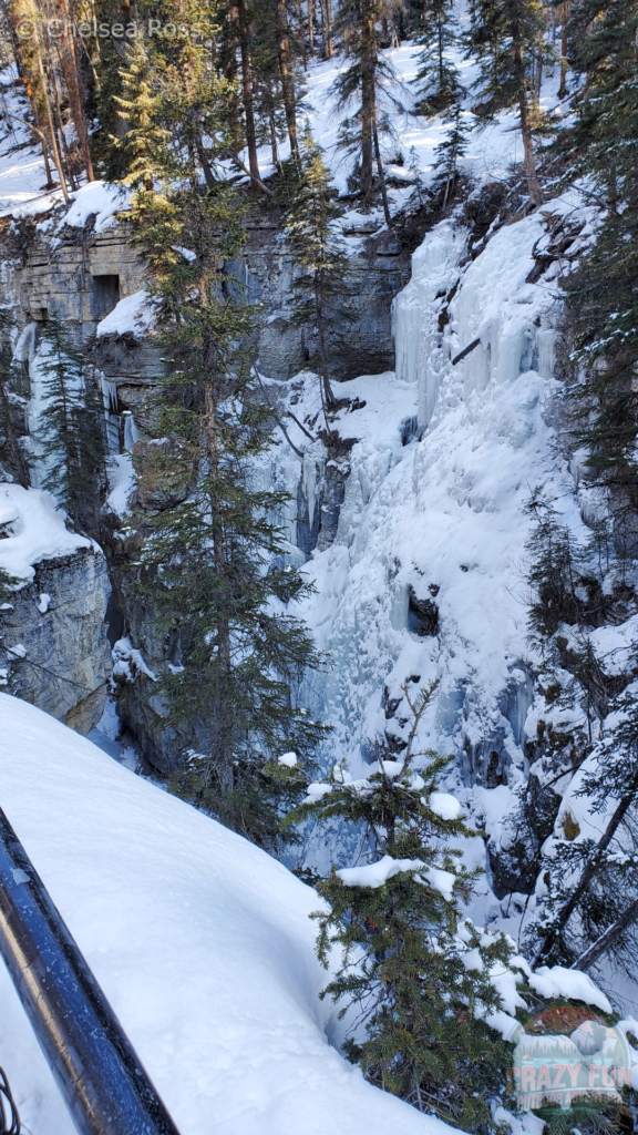 Looking across the trail at the ice hanging off the rocks on the Maligne Canyon Winter Hike.