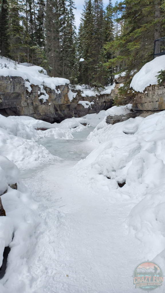 Showing the ice to get past on the trail in Maligne Canyon.