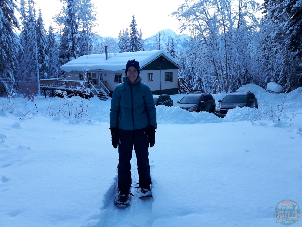 Ways to spend time outdoors: snowshoeing. My mom took my picture snowshoeing in front of our cabin. 