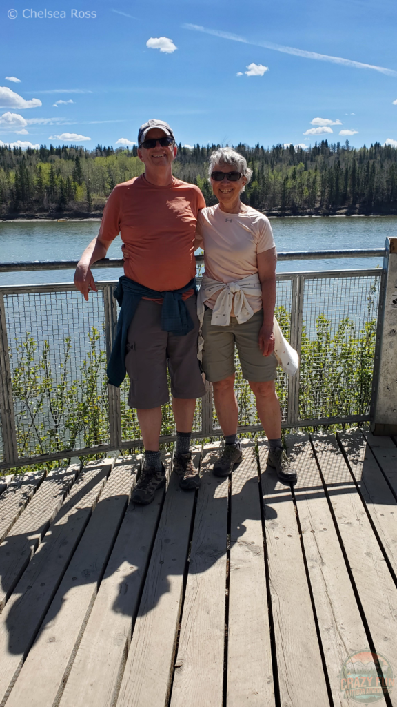 My parents in front of the river.