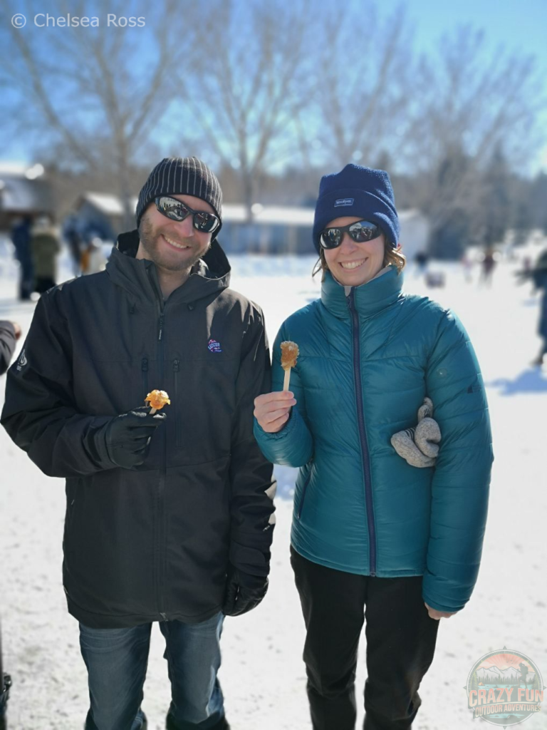 Kris and I holding our Maple taffy at La Cabane à Sucre.