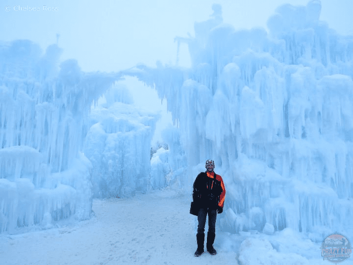 Ways to spend time outdoors: Kris standing in front of the ice castle.