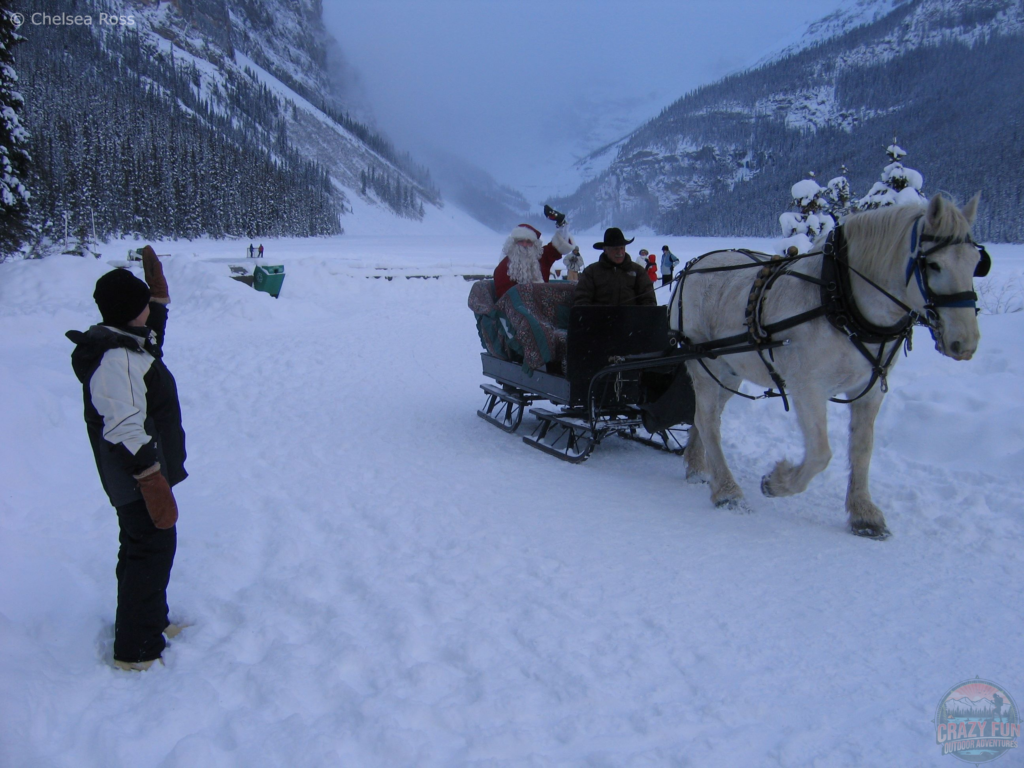 My grand-maman waving to Santa going by on a sleigh.