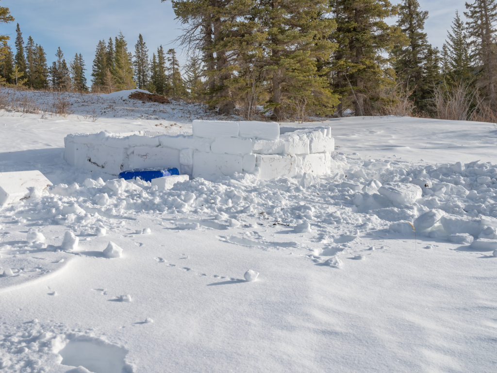 A snow fort created from snow blocks.