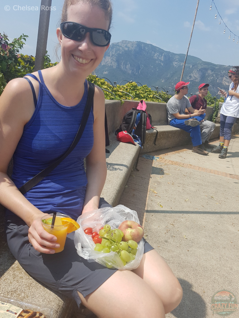 Unexpected Hike to Nocelle has me sitting in a plaza eating fruit.