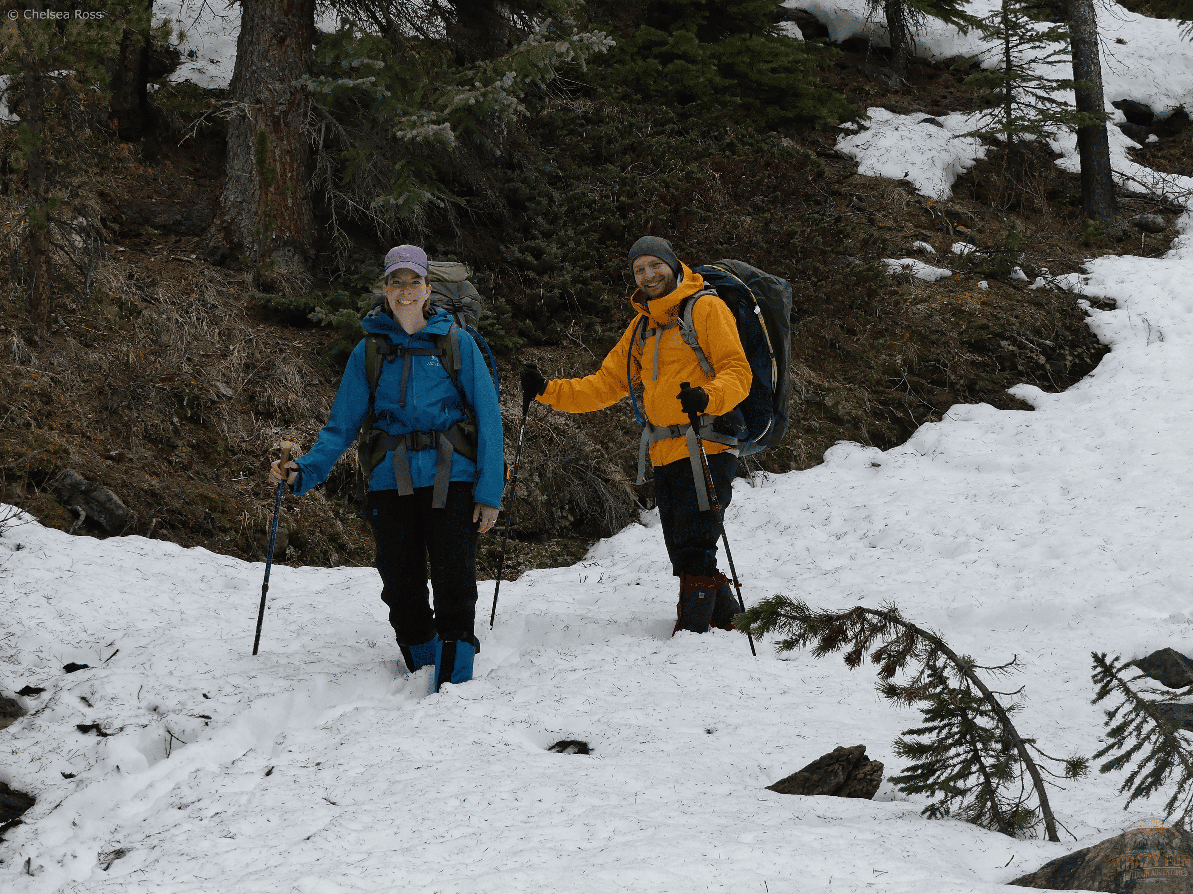 The red MEC Kokanee Gore-Tex Gaiters being showcased while backpacking in the snow.