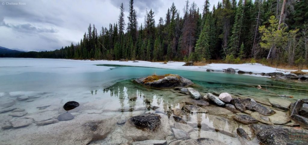 The greenish-blueish water pops in contrast to the snow creating a beautiful scene. 