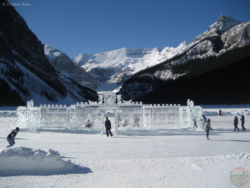 Looking at the ice castle on Lake Louise as the fourth of 5 Awesome Outdoor Skating Rinks in Alberta on a gorgeous sunny blue sky day. 
