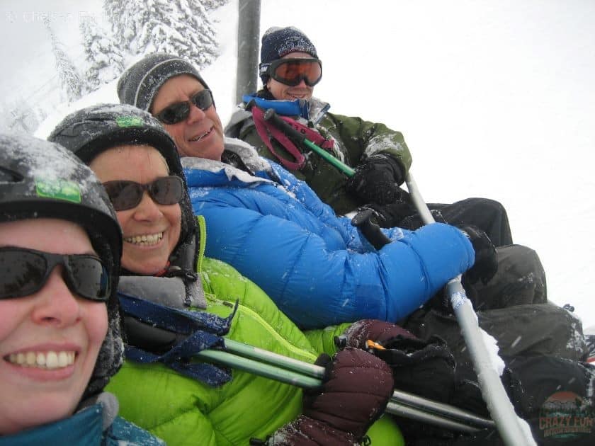 Selfie of the four of us sitting on a chair while downhill skiing in Avoriaz France.