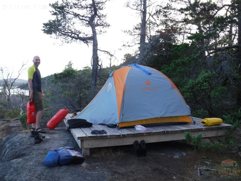 Multiple MEC Brooks Dry Bag around a tent platform.