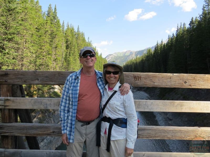 Best Hiking Gifts for Dads: Man wearing a sun shirt to protect his arms from the sun. Lady is to the right of him in her white long sleeve shirt. 