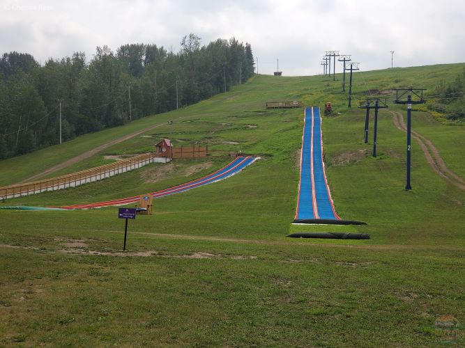 Tubing lanes down a ski hill for some summer tubing fun. 