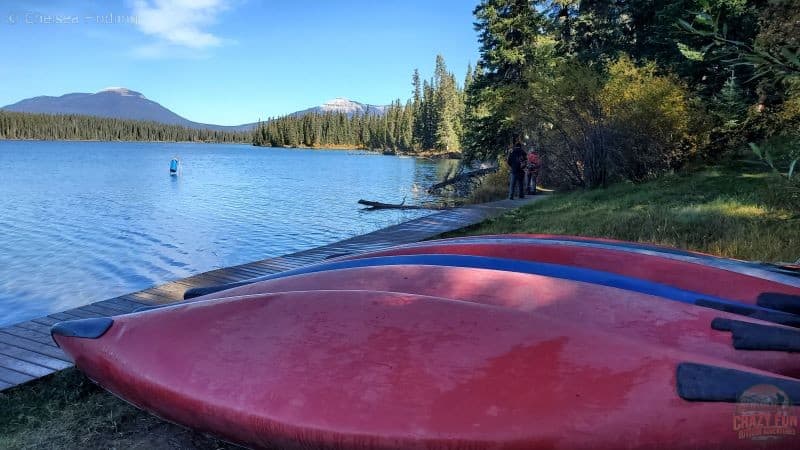 Canoes upside down near a lake